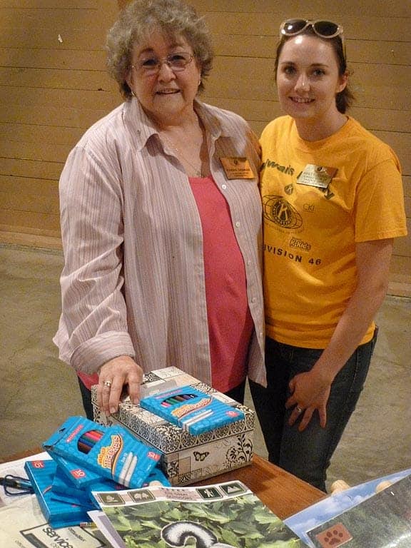 Volunteers Marsha Sherman and Ashley Johnson from in gym.