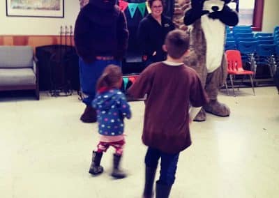 Kids run to see Smokey and Ranger at Camp